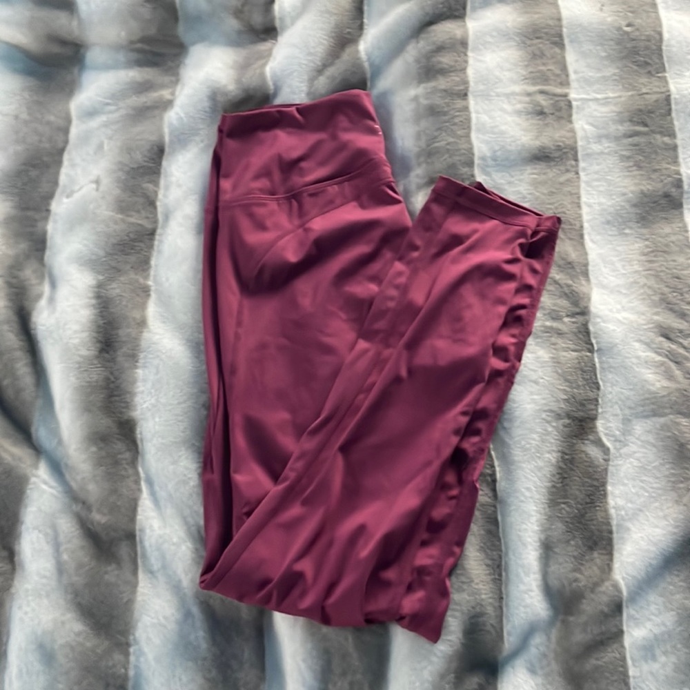 Pink, athletic leggings with a zipper pocket